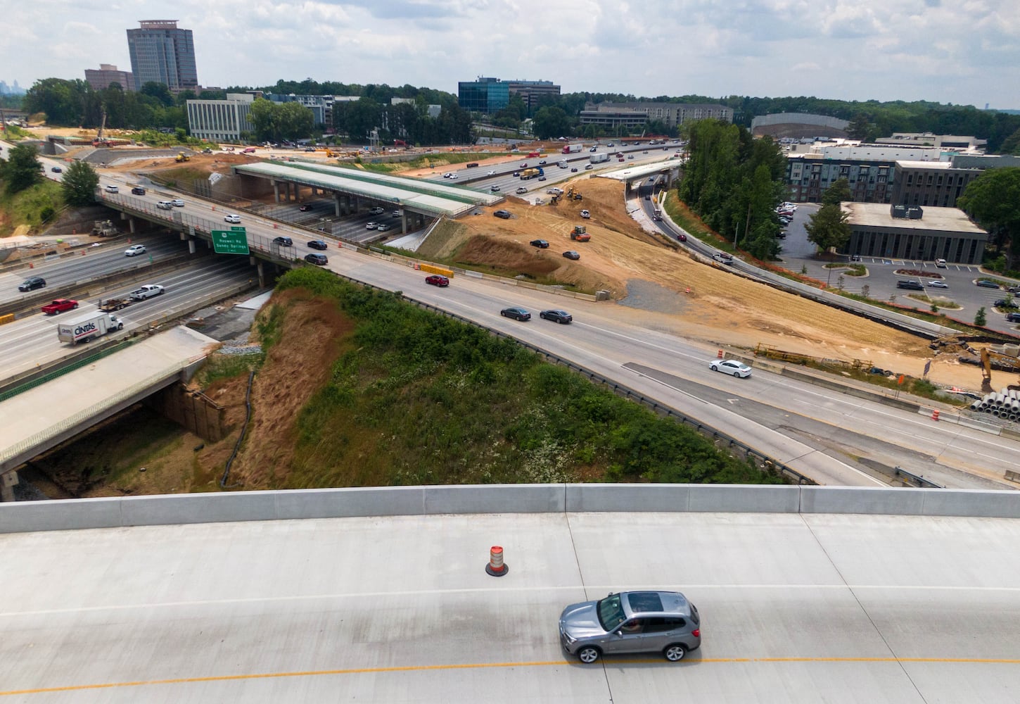 May 27, 2021 Sandy Springs - Aerial photo shows construction site of I-285 interchange at Ga. 400 in Sandy Springs on Tuesday, May 27, 2021. (Hyosub Shin / Hyosub.Shin@ajc.com)