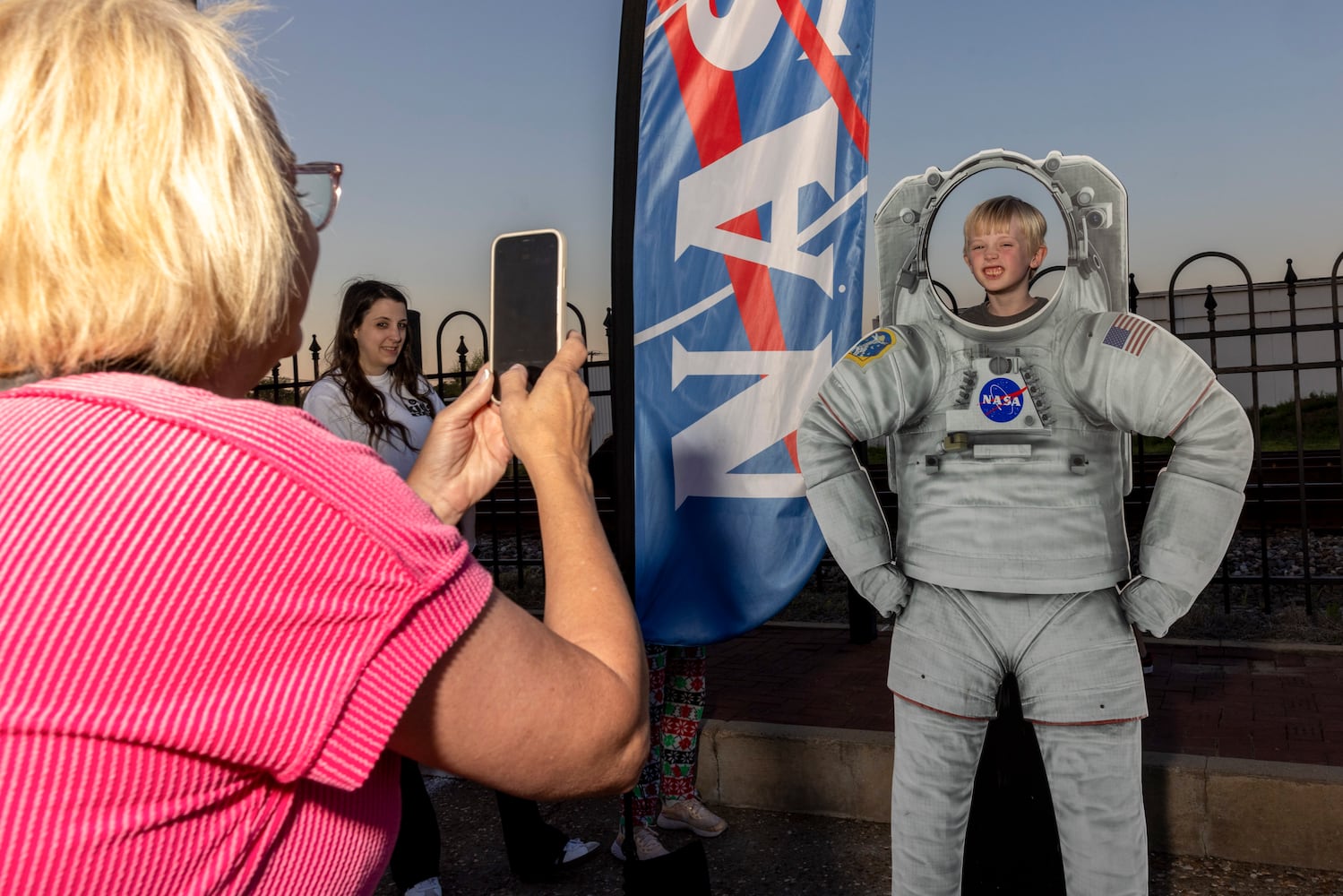 Carter Loyd, 5, poses in a NASA astronaut cutout ahead of the solar eclipse in Russellville, Ark., Sunday, April 7, 2024. (Alex Kent/The New York Times)