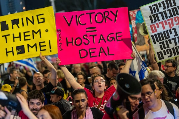 People shout slogans during a protest against Prime Minister Benjamin Netanyahu's government and call for the release of hostages held in the Gaza Strip by the Hamas militant group, in Tel Aviv, Israel, Saturday, Nov. 16, 2024. (AP Photo/Francisco Seco)