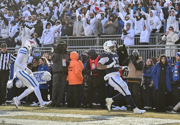 Penn State running back Kaytron Allen scores a touchdown against SMU during the first half in the first round of the NCAA College Football Playoff, Saturday, Dec. 21, 2024, in State College, Pa. (AP Photo/Barry Reeger)