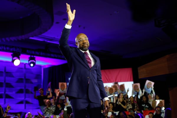 Sen. Raphael Warnock waves at supporters after winning the senate runoff election on Tuesday, December 6, 2022. (Natrice Miller/natrice.miller@ajc.com)  