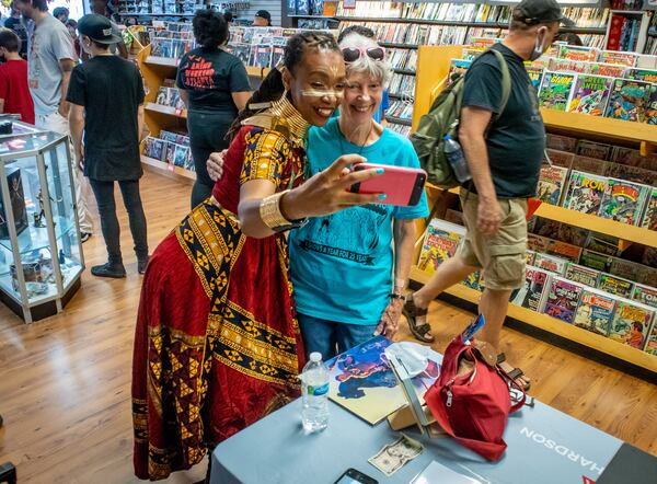 Diane Green poses for a selfie with Black Panther comic book artist Afua Richardson at the Galactic Quest comic book store during Free Comic Book Day in Lawrenceville on Saturday, August 14, 2021. STEVE SCHAEFER FOR THE ATLANTA JOURNAL-CONSTITUTION