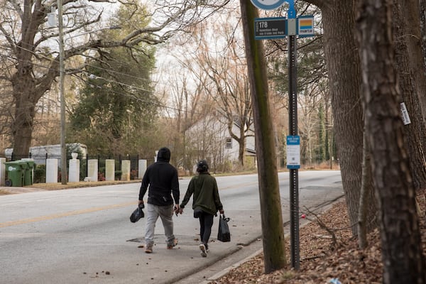 Residents on the south side of Atlanta walk down Browns Mill Road, a busy corridor that's slated for sidewalks as part of the city's T-SPLOST funding approved by voters in 2022. (Riley Bunch/AJC)