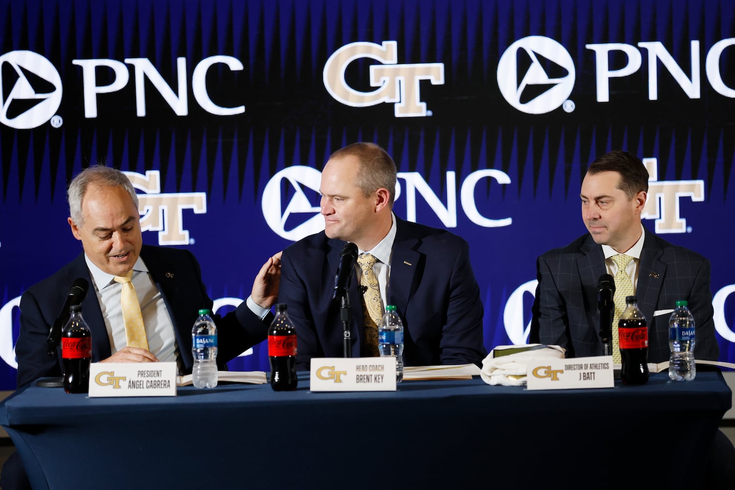 Georgia Tech President Ángel Cabrera (left) and athletic director J Batt (right) introduce the new football head coach Brent Key during a press conference on Monday, Dec. 5, 2022. Miguel Martinez / miguel.martinezjimenez@ajc.com