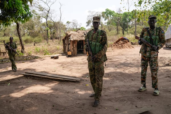 Soldiers stand at their outpost near Nzara, South Sudan on Saturday, Feb. 15, 2025. (AP Photo/Brian Inganga)