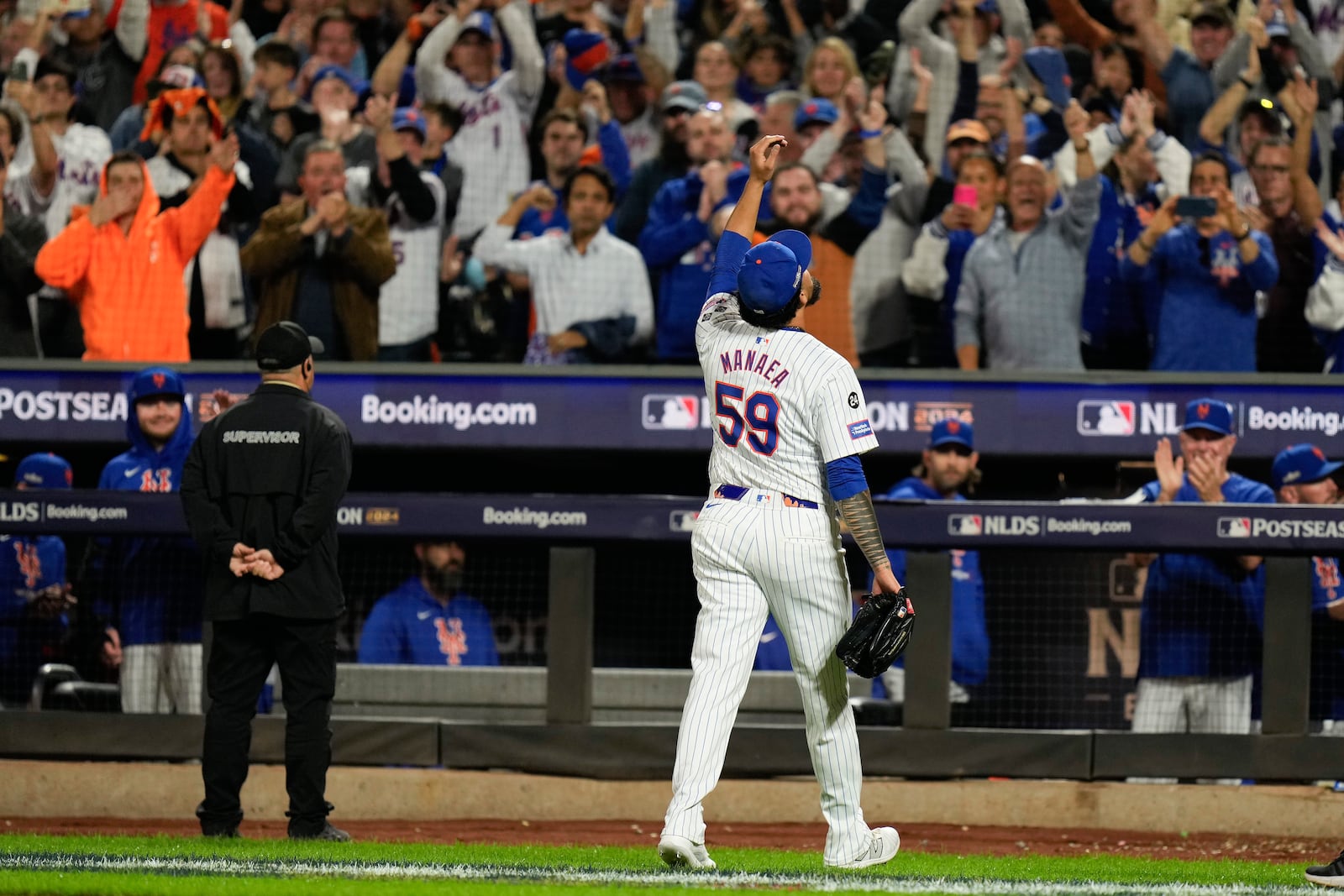 New York Mets pitcher Sean Manaea (59) reacts as he walks off the field during the eighth inning of Game 3 of the National League baseball playoff series against the Philadelphia Phillies, Tuesday, Oct. 8, 2024, in New York. (AP Photo/Seth Wenig)