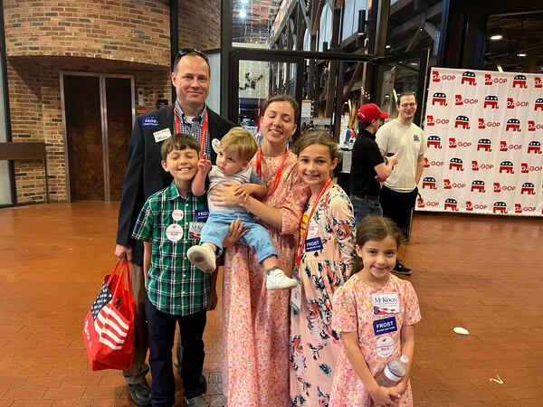 Married couple Stephen and Bethany Alligood and their five children (one of whom was hiding behind them) all made the trip to the GOP convention in Columbus, Georgia, where they were seen on Saturday, June 10, 2023.