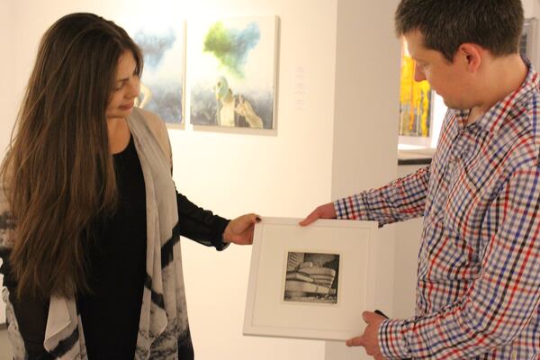 Curator Victoria Borisova and Christopher Parrott consult about his work for a show at the Manhattan gallery Arte Ponte. CONTRIBUTED BY FELICIA FEASTER