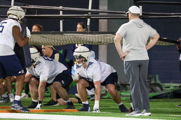 Georgia Tech coach Bent Key watches as offensive lineman Jameson Riggs (70) and others participate in a drill during their first day of spring football practice at the Brock Indoor Practice Facility, Monday, March 11, 2024, in Atlanta. (Jason Getz / jason.getz@ajc.com)