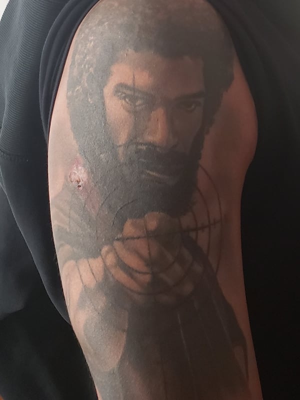 Rumal Rackley, the son of Gil Scott-Heron, memorializes his father with a tattoo on his arm.