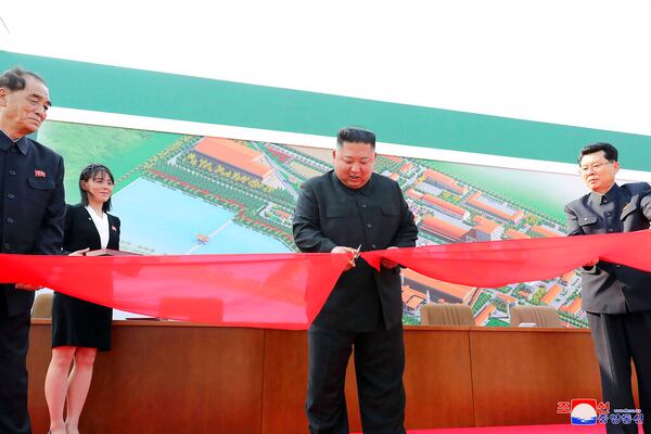  In this Friday, May 1, 2020, photo provided by the North Korean government, North Korean leader Kim Jong Un, center, cuts a tape, watched by his sister Kim Yo Jong, during his visit to a fertilizer factory in Sunchon, South Pyongan province, near Pyongyang, North Korea. Kim made his first public appearance in 20 days as he celebrated the completion of the fertilizer factory, state media said Saturday, May 2, 2020, ending an absence that had triggered global rumors that he may be seriously ill.  Independent journalists were not given access to cover the event depicted in this image distributed by the North Korean government. The content of this image is as provided and cannot be independently verified. Korean language watermark on image as provided by source reads: "KCNA" which is the abbreviation for Korean Central News Agency. (Korean Central News Agency/Korea News Service via AP)