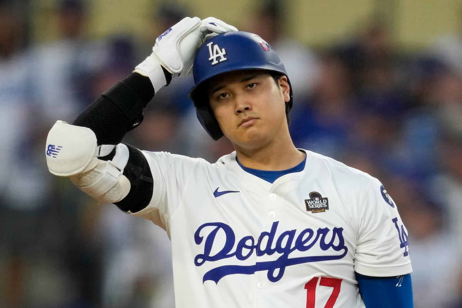 Los Angeles Dodgers' Shohei Ohtani reacts after striking out against the Los Angeles Dodgers during the third inning in Game 1 of the baseball World Series, Friday, Oct. 25, 2024, in Los Angeles. (AP Photo/Ashley Landis)