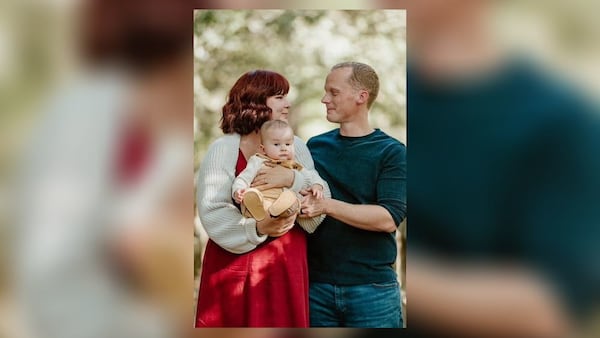 Cobb County Officer Shawn Shuff, with his wife Erin and 9-month-old son Archie. 