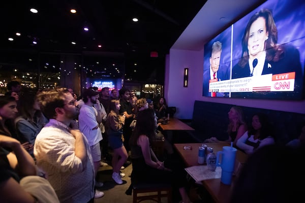 People attend a watch party earlier this month for the U.S. presidential debate between Democratic presidential candidate Kamala Harris and the Republican nominee, Donald Trump. Harris has challenged Trump to return to Atlanta on Oct. 23 for a second showdown in Atlanta on Oct. 23. So far, he has declined. (Allison Bailey/AFP/Getty Images/TNS)