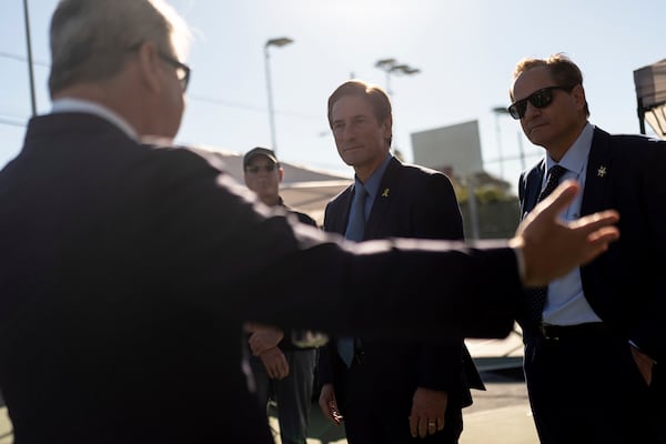 Nathan Hochman, center, the newly elected Los Angeles County district attorney, listens to Redondo Beach, Calif., city attorney Michael Webb during a Housing Initiative Court session in Hermosa Beach, Calif., Wednesday, Nov. 13, 2024. (AP Photo/Jae C. Hong)