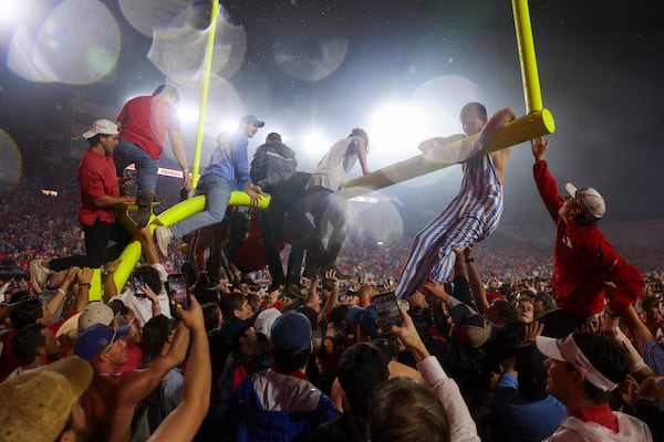 Mississippi fans celebrate by taking down a goal post after Mississippi defeated Georgia 28-10 at Vaught Hemingway Stadium, Saturday, November 9, 2024, in Oxford, Ms. (Jason Getz / AJC)
