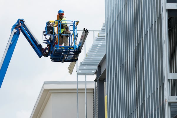 FILE Construction worker works outside of commercial building site during a hot weather in Mount Prospect, Ill., Tuesday, Aug. 27, 2024. (AP Photo/Nam Y. Huh, File)