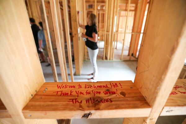 A note welcoming 1st Sgt. Ryan Davis and his family to Richmond Hill is written on a stud in the framing of the new home being built for the Davis family by the Gary Sinise Foundation.