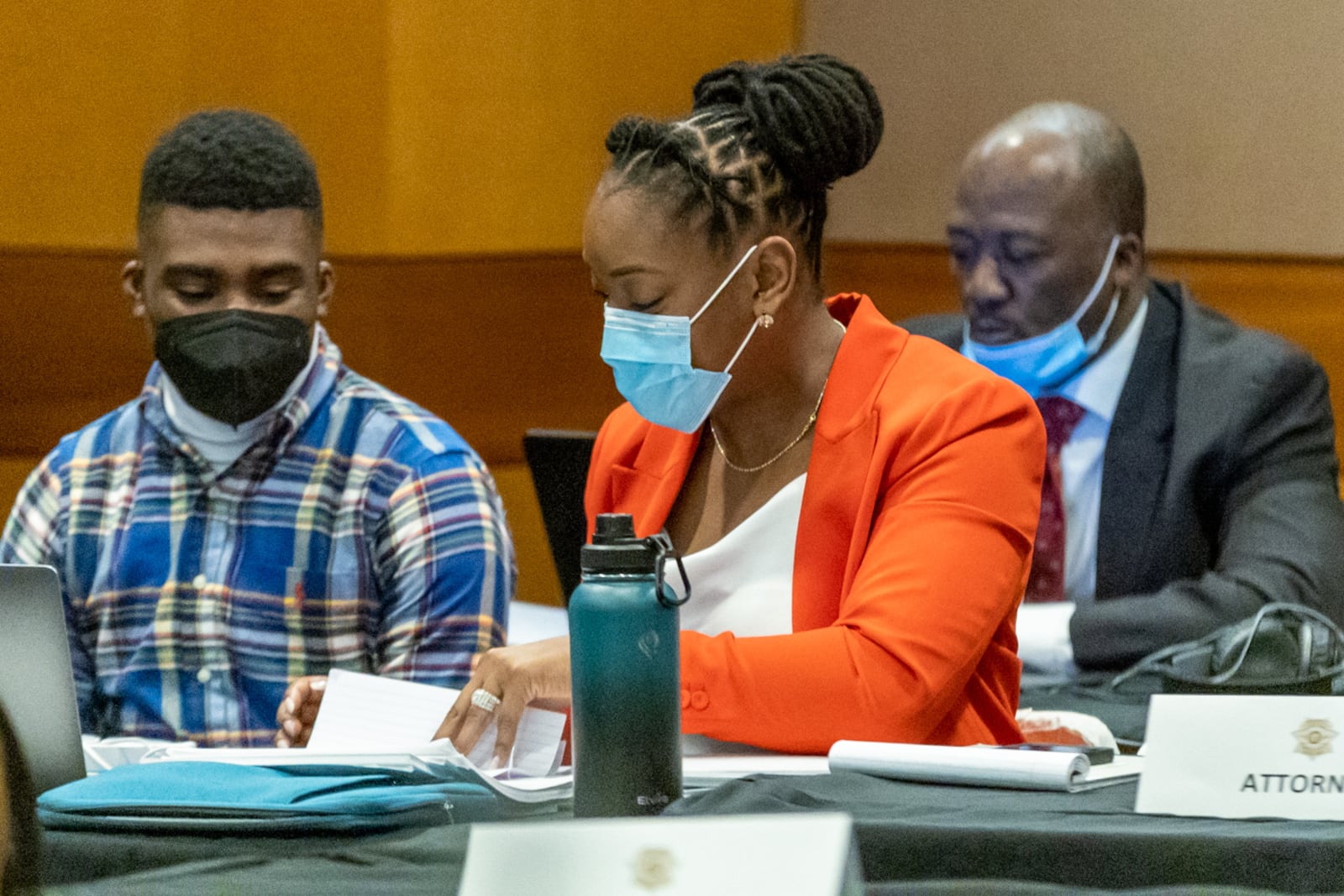 Khalieff Adams, left, talks with his Attorney, Teombre Calland, as they wait for the Jury selection portion of the trial to continue in a Fulton County courtroom on Tuesday, Jan. 24, 2023.  (Steve Schaefer/steve.schaefer@ajc.com)