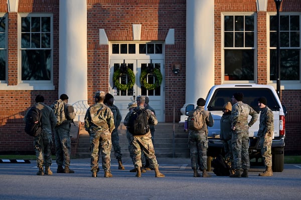 Military personnel at Plains High School Visitor Center and Museum on Friday. (Hyosub Shin / AJC)