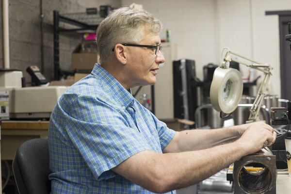 Quality technician LaMar McDougal measures the “convolution” of a metal hose at the American BOA Inc. manufacturing plant in Cumming. It can’t be off by more than 0.4 millimeters. (ALYSSA POINTER/ALYSSA.POINTER@AJC.COM)