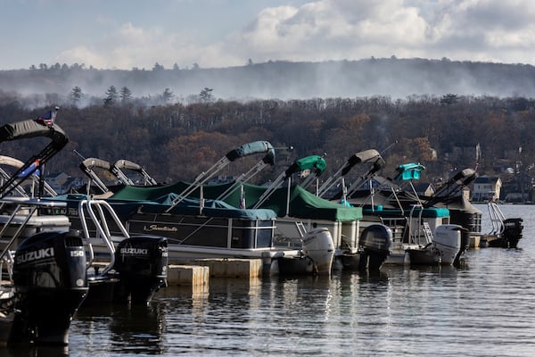 Smoke rises from a wildfire in a forested mountain area across from Greenwood Lake, Monday, Nov. 11, 2024, in Lakeside, New Jersey. (AP Photo/Stefan Jeremiah)