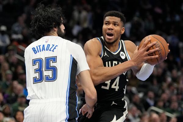 Milwaukee Bucks' Giannis Antetokounmpo tries to get past Orlando Magic's Goga Bitadze during the second half of an Emirates NBA cup tournament quarterfinals basketball game Tuesday, Dec. 10, 2024, in Milwaukee. (AP Photo/Morry Gash)