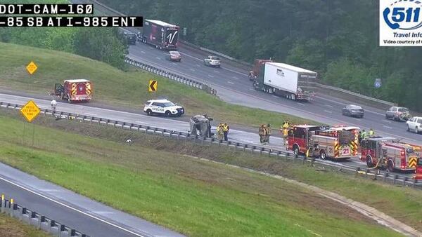 Several drivers who saw the burning van on I-85 tried to rescue the passengers.