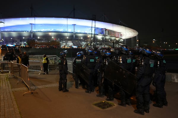 Police officers take position ahead of the Nations League soccer match France against Israel outside the Stade de France stadium, Thursday, Nov. 14, 2024 in Saint-Denis, outside Paris. (AP Photo/Aurelien Morissard)