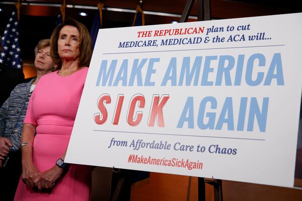 House Minority Leader Nancy Pelosi of Calif., and Sen. Tammy Baldwin, D-Wis. listens during a news conference on President Barack Obama's signature healthcare law, Wednesday, Jan. 4, 2017, on Capitol Hill in Washington. (AP Photo/Evan Vucci)