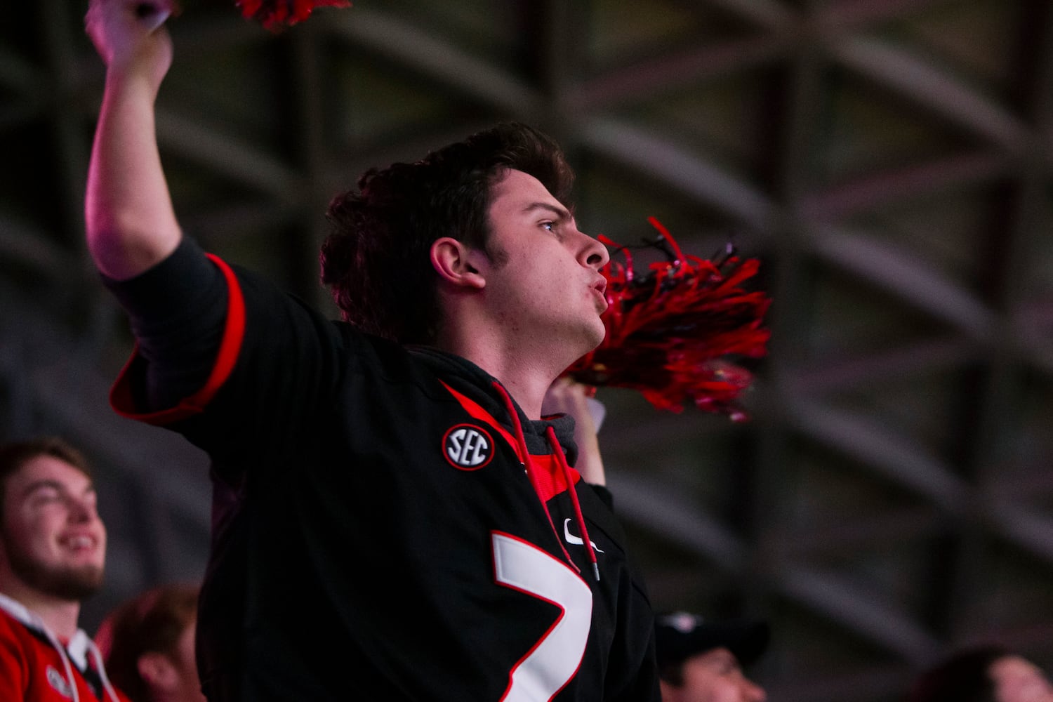 Alex Reiniche celebrates during a watch party for the College Football Championship on Monday, January 9, 2023, at Stegeman Coliseum in Athens, Georgia. The University of Georgia defeated the Texas Christian University football team 65-7. CHRISTINA MATACOTTA FOR THE ATLANTA JOURNAL-CONSTITUTION.