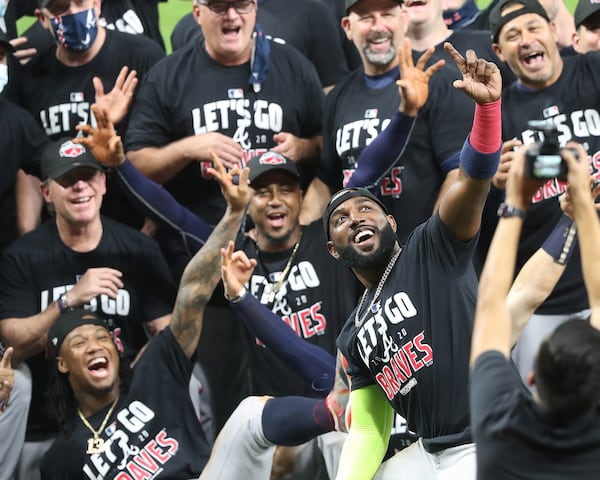 It’s selfie time led by Marcell Ozuna (right) with Ronald Acuna and Ozzie Albies as the Atlanta Braves celebrate advancing to the NL Championship Series by defeating the Marlins 7-0 in Game 3 of the NLDS completing their second consecutive postseason series sweep on Thursday, Oct 8, 2020 in Houston.  (Curtis Compton / Curtis.Compton@ajc.com)