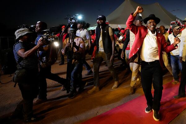 Botswana's President and Democratic Party leader Mokgweetsi Masisi dances during his election rally, a day before elections in Gaborone, Botswana, Tuesday, Oct. 29, 2024. (AP Photo/Themba Hadebe)