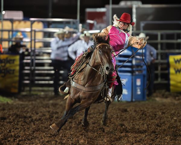 Rodeo clown Colt Hartt plays to the crowd -- and disguises his considerable riding skill -- on a borrowed horse during a rodeo in Rome in August. 
(Courtesy of Christine Hoesl)