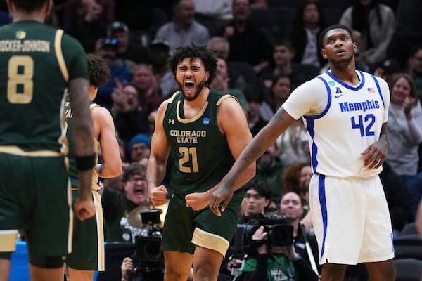 Colorado State forward Rashaan Mbemba (21) reacts to drawing a foul from Memphis forward Nicholas Jourdain as forward Dain Dainja (42) looks on during the second half in the first round of the NCAA college basketball tournament, Friday, March 21, 2025 in Seattle. (AP Photo/Lindsey Wasson)