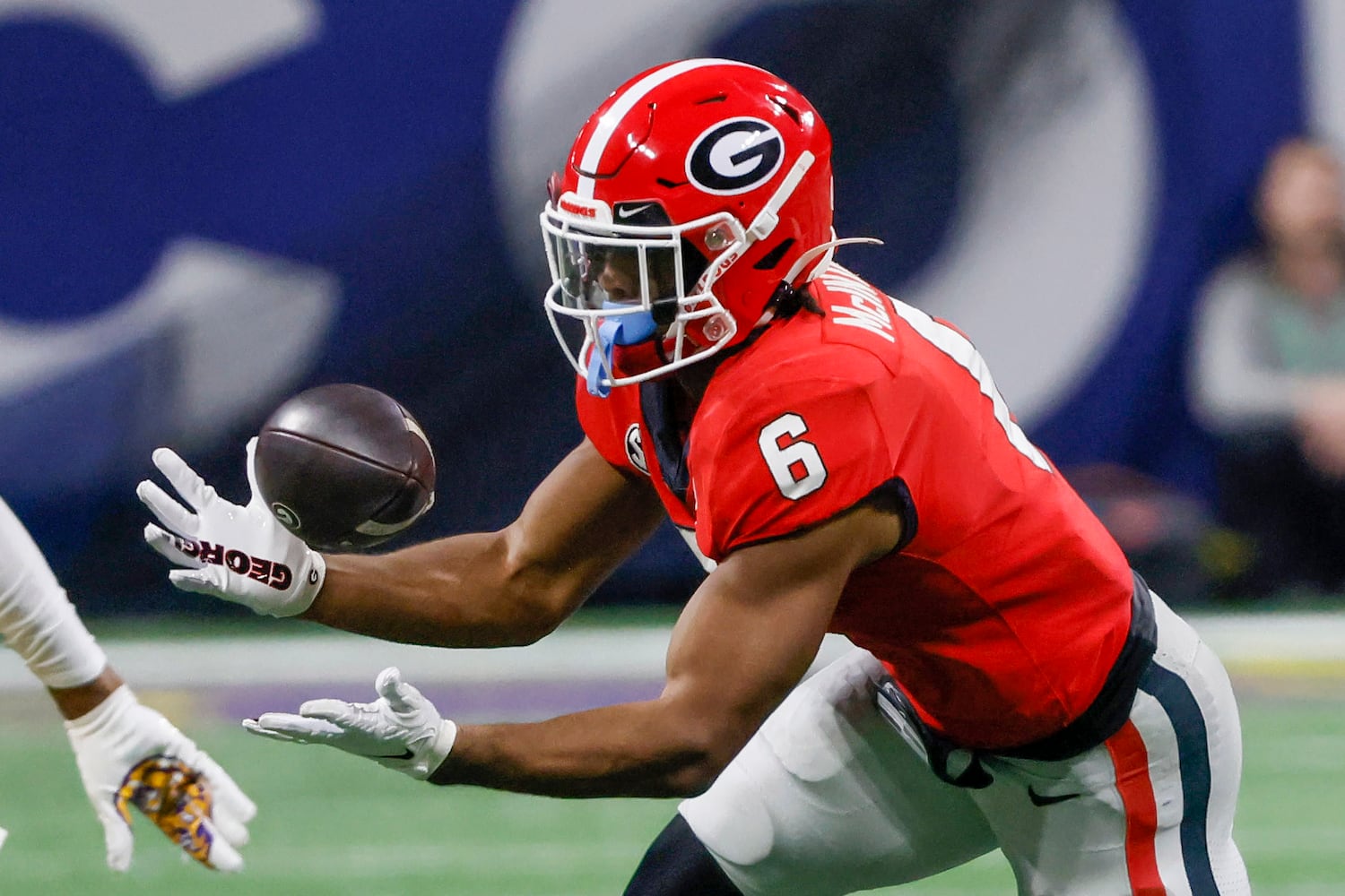 Georgia Bulldogs running back Kenny McIntosh (6) bobbles the football against the LSU Tigers during the second half of the SEC Championship Game at Mercedes-Benz Stadium in Atlanta on Saturday, Dec. 3, 2022. (Bob Andres / Bob Andres for the Atlanta Constitution)