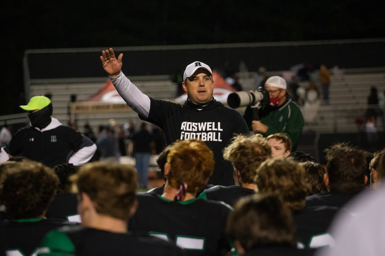 Chris Prewett, head varsity football coach for Roswell, speaks to his team after their victory against Mill Creek on Friday, November 27, 2020, at Roswell High School in Roswell, Georgia. Roswell defeated Mill Creek 28-27. CHRISTINA MATACOTTA FOR THE ATLANTA JOURNAL-CONSTITUTION