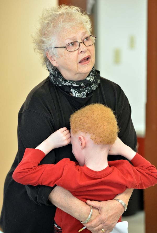 Anita Beaty comforts Ezekiel Simmons, 5, as she confers with staff at the Metro Atlanta Task Force for the Homeless on November 7, 2013. HYOSUB SHIN / HSHIN@AJC.COM