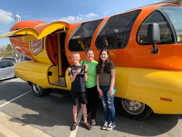 Jennifer Troncolli of Suwanee saw on social media that the Wienermobile was in the town center and rushed over with her 11-year-old son Josh and his friend Bridget. RODNEY HO/rho@ajc.com