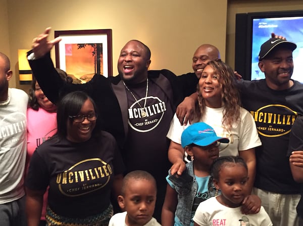 Jernard Wells, surrounded by family, after the "Food Network Star" season finale at Gordon Biersch. CREDIT: Rodney Ho/ rho@ajc.com