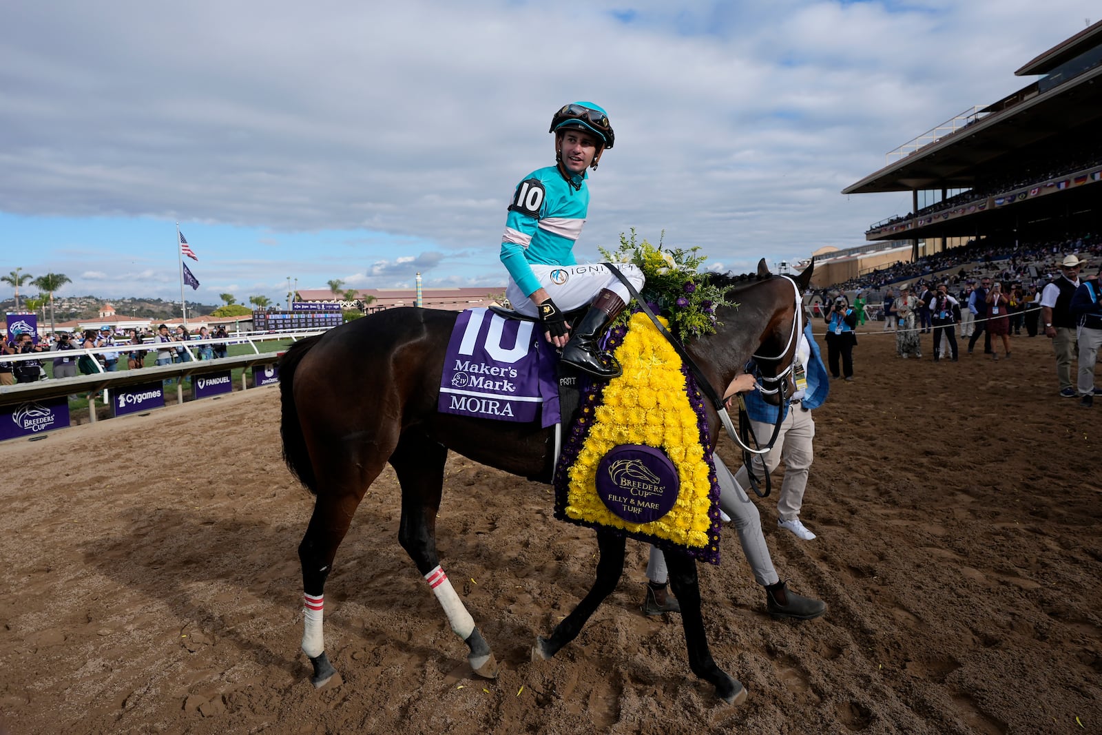 Flavien Prat reacts after riding Moira to victory in the Breeders' Cup Filly and Mare Turf horse race in Del Mar, Calif., Saturday, Nov. 2, 2024. (AP Photo/Gregory Bull)