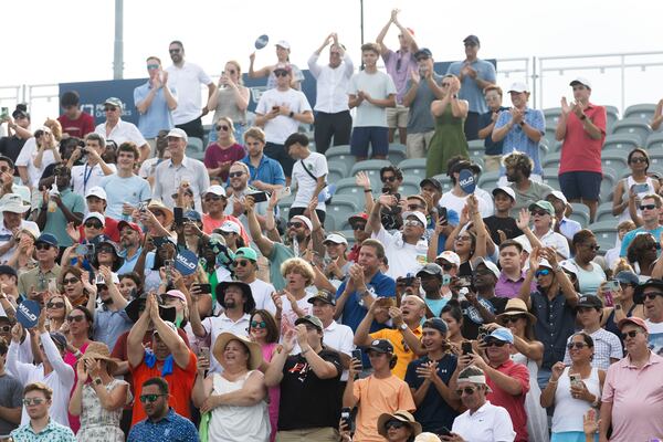 Attendees cheer on after Taylor Fritz wins in a three match game against Aleksandar Vukic during the Atlanta Open final match in July 2023. (Michael Blackshire/Michael.blackshire@ajc.com)