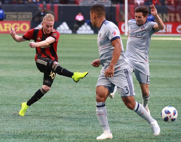 October 21, 2018 Atlanta: Atlanta United midfielder Andrew Carleton gets off a shot on goal between Chicago Fire defenders Brandon Vincent and Brandt Bronico during the second half in a MLS soccer match on Sunday, Oct 21, 2018, in Atlanta.   Curtis Compton/ccompton@ajc.com