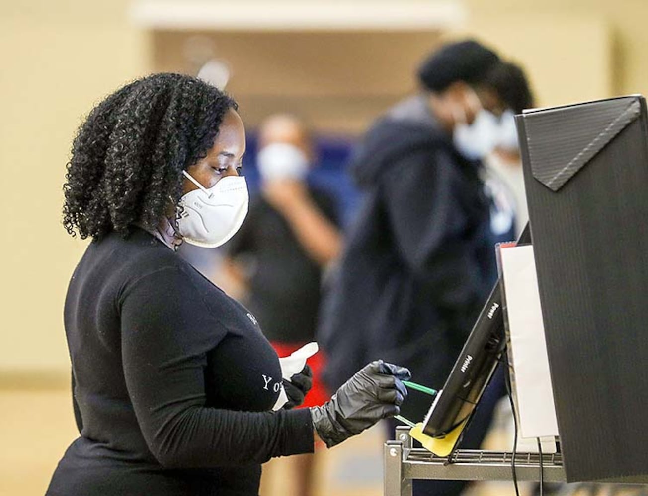 PHOTOS: Georgia voters struggle with long lines, new equipment, social distancing