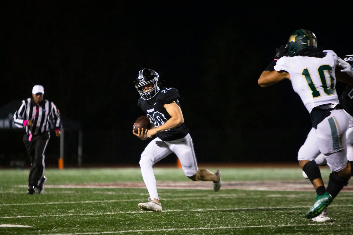 Jack Yeager, middle linebacker for Alpharetta, runs the ball during the Alpharetta vs. Blessed Trinity high school football game on Friday, October 28, 2022, at Alpharetta high school in Alpharetta, Georgia. Alpharetta led Blessed Trinity 21-7 at the end of the first half.