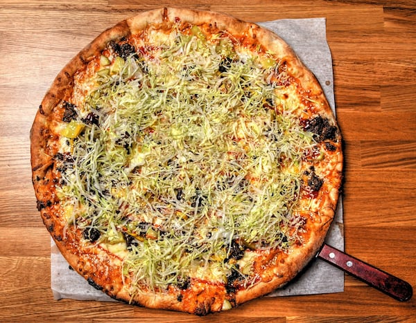 The McDowell, aka the cheeseburger pie, is a favorite with families who visit Pielands Sub & Slice. (Chris Hunt for The Atlanta Journal-Constitution)