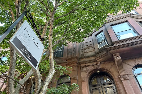 FILE - A for sale sign hangs in front of a home in the Park Slope neighborhood in the borough of Brooklyn in New York on Oct. 10, 2024. (AP Photo/Peter Morgan, File)