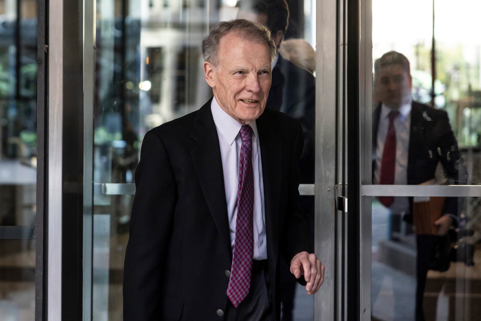 Illinois' former House Speaker Michael Madigan, charged in a multimillion-dollar racketeering and bribery scheme that included the state’s largest utility, ComEd, walks out of the Dirksen Federal Courthouse, Wednesday, Oct. 9, 2024 in Chicago. (Ashlee Rezin/Chicago Sun-Times via AP)