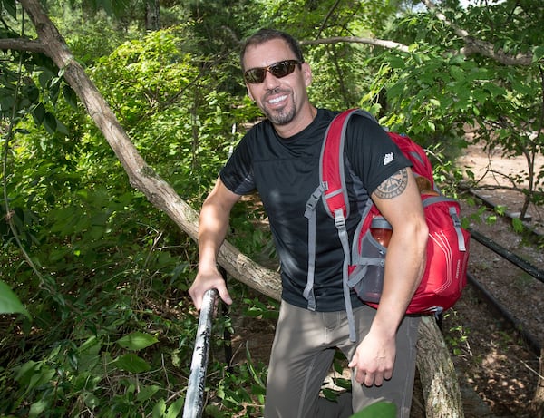 During a stopover in Stone Mountain Park recently, Carl Byington of Ellijay talks about recovering from a serious climbing injury, then running marathons on seven continents. CONTRIBUTED BY STEVE SCHAEFER