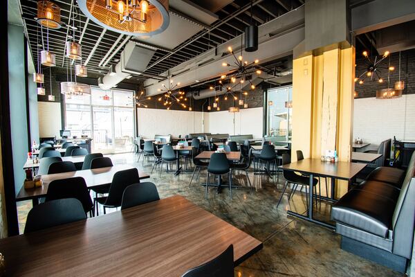 The dining room at Firepit Pizza Tavern, located in the new Grant Park development called the Larkin. CONTRIBUTED BY HENRI HOLLIS